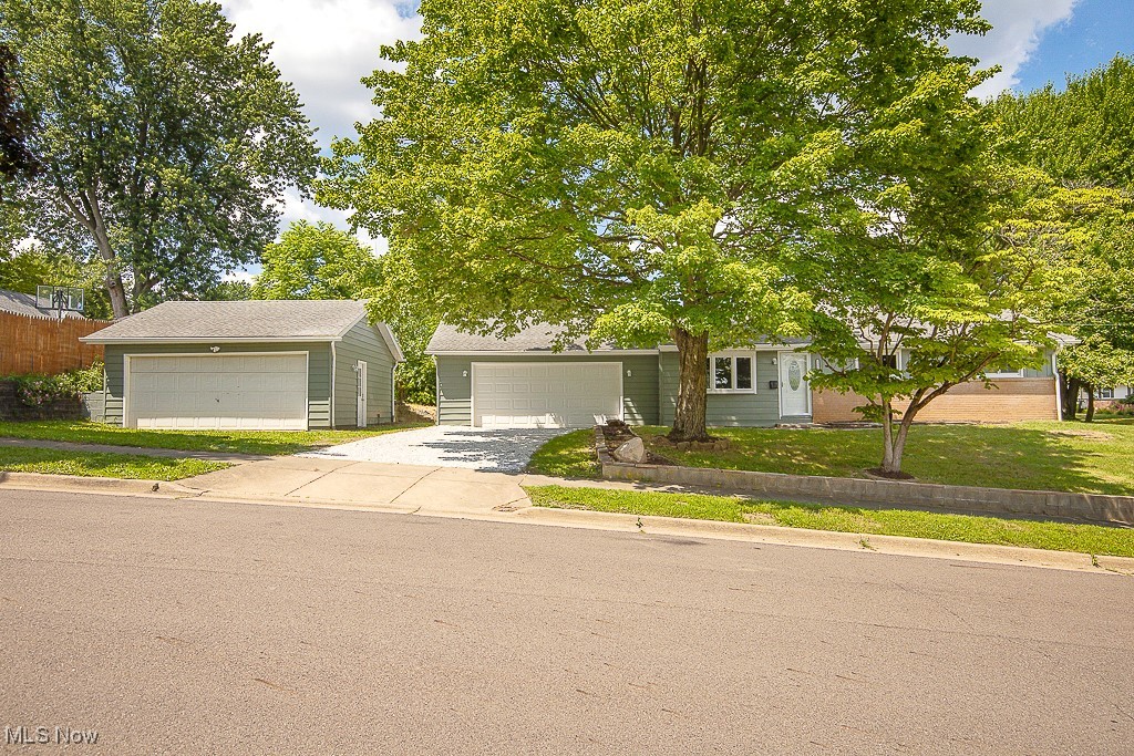 The search is over! This newly renovated 3 bedroom, 2 bathroom ranch is a must see! Fresh paint adorns the exterior of the home along with new exterior doors and refreshed gravel driveway. Inside you're greeted by all new paint, LVP flooring & carpeting throughout. You'll be impressed with the stylish new kitchen featuring granite countertops, new white Shaker-style cabinets and stainless steel appliances! Newly renovated bathroom is down the hall, centrally located to bedrooms. Built in storage closets. The lower level offers abundant storage space, laundry hook ups, & additional bathroom. Brand new furnace and air-conditioner. Newer roof with plenty of life left. Newer HWT (2023). Attached 2 car garage, with additional detached 2 car garage, all situated on a great sized corner lot. Owner is licensed agent. Don't miss this one, schedule today!