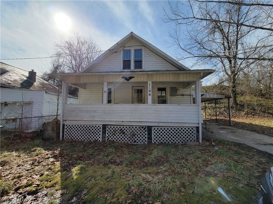 4 bedroom 1 bath bungalow features 2 bedrooms on the main level. Covered front porch and 1-car carport. Living room with wood floors and french patio doors onto the covered carport that could also be used as a patio. Full bath and laundry area on first floor. Galley style kitchen. Bonus room addition on rear of home could be used for rec room, or home office. Upstairs are 2 additional bedrooms in the fully finished walk up attic.