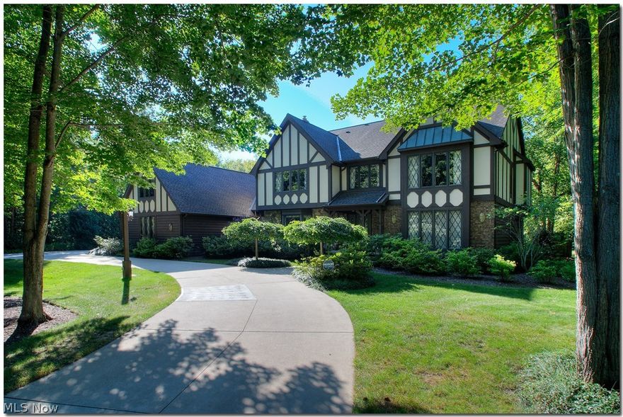 Welcome to peaceful...follow the horseshoe driveway, with custom light posts, as it showcases the professionally designed 5.50 acres of landscaping. River rock, Hardi board and cedar finish the outside of this home. Enter the 2-story foyer and the flow of the hardwood floors takes you to the formal living room/dining room, to the left, the office with custom designed built-ins. The gorgeous designer kitchen includes a subzero refrigerator, stainless appliances and too many Maple cupboards to count. The huge island/breakfast bar encourages guests to visit the chef and grab a snack. French doors from the kitchen steps down into the vaulted 3-season sun room. The focal point in the vaulted family room is the floor to ceiling river rock fireplace and custom bookshelves. Remodeled full bath, 1/2 bath and laundry room finish the first floor. The second floor has 4 brs. with a 35x13 bonus room with walk-in attic and a total remodel full bath. The master bedroom features a sitting room, remodeled ensuite bathroom with walk-in shower, jetted tub and dual vanity. The SPOTLIGHT of this home? A heated in-ground pool(new liner 6/17) and Azec deck for hours of summer fun. A 5-car heated garage, with 8' doors, drains and slop sink is perfect for the car enthusiast. Solon is a 30 minute commute to downtown Cleveland, offers fine dining, local shops,  boutiques, a movie theater, golf, parks, community center, arts, aquatics, fitness, and much more!  Everybody has a story....begin yours here!