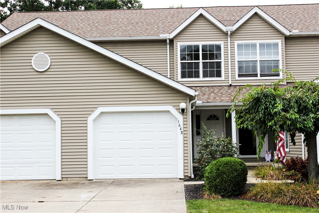Welcome to this completely renovated condominium in Streetsboro, conveniently located close to Rt 303 and Rt 14. Recent updates (2025) include all new LVP flooring, brand new carpet, brand new appliances, new bathroom vanity and fixtures and a fresh coat of paint throughout. The main level features a half bath, coat closet and garage access and an open kitchen and living area with a sliding glass door to a private patio. Upstairs offers two spacious bedrooms with ample closet space, and a beautifully updated full bath with direct access from one of the bedrooms. The basement provides a laundry area, plenty of storage and rough-ins for a potential second full bathroom.