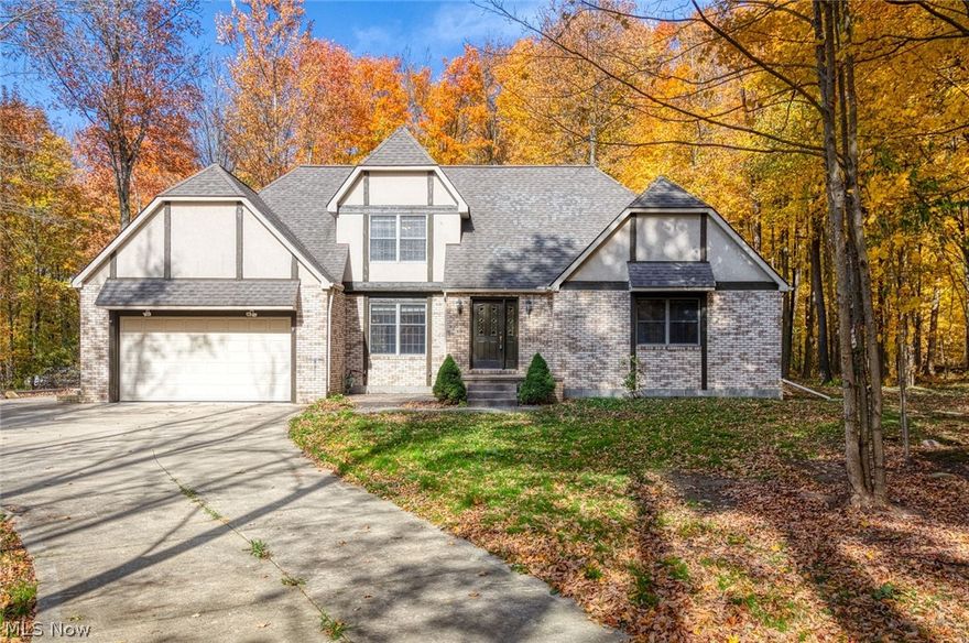 Prime village location on quiet cul-de-sac street with a mostly wooded lot. Enter into the 2 story foyer with an open stairway and see directly into the dining room to the left and the comfortable living room with built-ins, gas fireplace and surround sound straight ahead.  Beautiful laminate flooring through out this area and into the kitchen with island and counter top range.  There is a breakfast nook with sliders leading to the back deck off of the kitchen, perfect for summertime grilling!  A laundry/mud room is right off the of the kitchen, where you can enter through the garage.  There are 2 bedrooms on the first floor, the master has an en-suite with double sinks and a walk in closet.  Upstairs you will find 2 more bedrooms, another full bath and a large bonus room with skylights that would be a great play room, or office, or ...!   There is an unfinished 12x22 area with a loft off of a bedroom that is a great storage area or could be finished for even more space and there is a