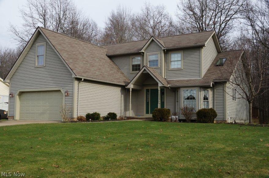 Check out this quality built 2 story, 4 bedroom, 2 1/2 bath home located in Rootstown.  Featuring views of a wooded lot, oversized 2 car garage, cathedral ceilings, wood burning fireplace, geothermal HVAC system, security system, 1st floor laundry room, 1st floor owners suite complete with Jacuzzi and separate shower, finished basement, bayed kitchen with lots of cabinets for storage.  Conveniently located.  Close to NEOMED, KSU, shopping and expressway.  Make an appointment today to see this wonderful home!