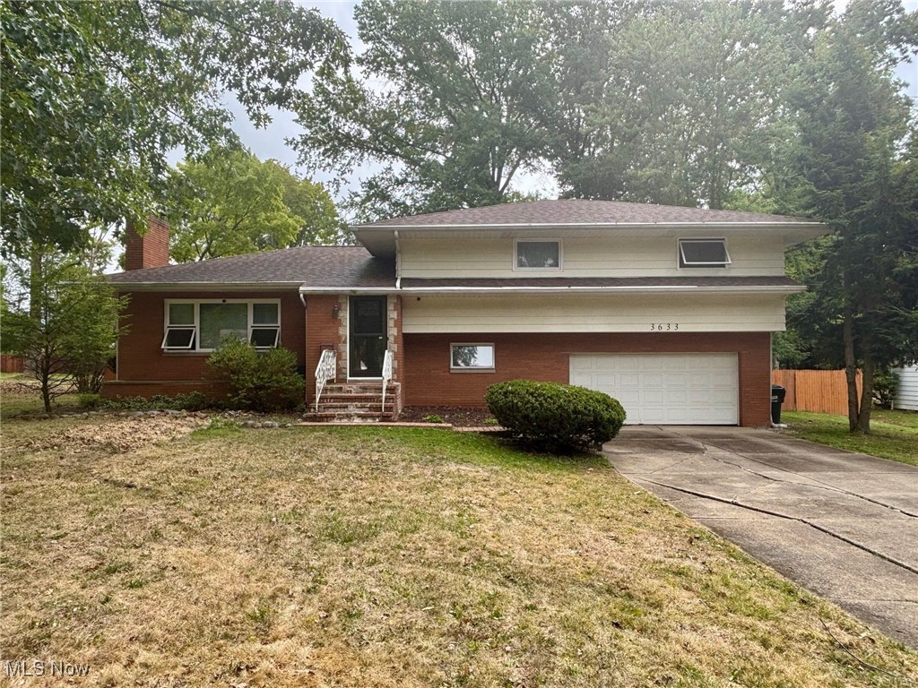 Welcome to this spacious split-level home in Stow offering 4 bedrooms and 1.5 baths on a large fenced lot. The main level is filled with natural light and features a living room with wood-burning fireplace, dining area, and an eat-in kitchen. Upstairs you’ll find four roomy bedrooms with original hardwood floors, a full bath, and a charming built-in storage feature in the hallway. The lower level offers a comfortable family room with French doors leading to a concrete patio, plus a convenient half bath. The unfinished basement provides laundry space along with plenty of room for storage and a potential recreation area. Outdoors, the large yard includes gas and electric connections from a previous pool setup—ideal for adding a future pool, creating an outdoor kitchen, or enjoying a firepit. Conveniently located in the Stow-Munroe Falls School District near local parks, shopping, dining, and major roadways, this home offers both comfort and accessibility within the Stow-Munroe Falls community. With original character and opportunities for personalization, move right in and make it your own! Updates include: Roof (5 years), Furnace (10 years), Water Heater (12 years), Lateral Sewer Line to house (2025), Front Entry and Storm Doors (2022), French Door (2020), Carpet (2022), Fans/Light Fixtures (2022), Jetted Tub (2020), Lower Level Flooring (2020), and Stove Top (2022).