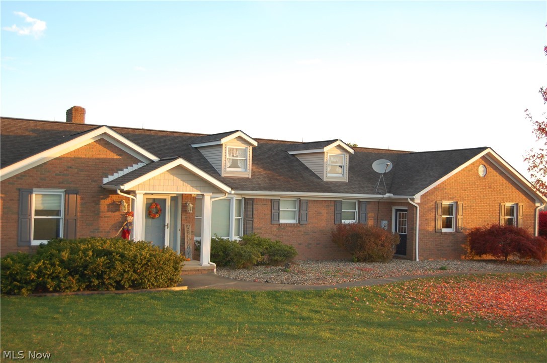 Custom built in 1994 this home is situated at the top of the hill just outside of Sugarcreek and has approximately 4.8 acres with amazing views of Sugar Valley. The main level has 3 bedrooms, open concept kitchen/dining and living room with hardwood floors. The main level kitchen has a pantry and an island with bar stools included. The master bedroom is off the kitchen. It includes a master walk in closet, shower, double sinks and spa tub. The other two bedrooms and bath are on the other side of the house. The main level has a composite deck with access from the living room or master bedroom, new decking in 2020. New water well and pump in 2021. There is access to the backyard from the deck. Fireworks can be viewed from the deck. You enter from the attached two car garage into a large laundry/mudroom with two closets and many cabinets. It should be noted that all the cabinets on both levels are Mullet cabinets.
The lower level is accessed through stairs off the mudroom or from t