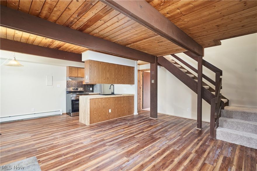 RARE END UNIT WITH WRAP AROUND DECK OVERLOOKING THE VALLEY! BETTER THAN NEW! RENOVATED CONDO WITH NEW CARPETING, LIGHT FIXTURES, UPDATES THROUGHOUT! THIS SPACIOUS CONDO HAS A BEDROOM AND FULL BATHROOM ON BOH LEVELS. THE LIVING ROOM FEATURES A BEAUTIFUL, STONE FIREPLACE AND THE KITCHEN AND APPLIANCES ARE RENOVATED! LAUNDRY ROOM IS IN THE UNIT, OFF OF THE FIRST FLOOR BEDROOM. THEY ARE REPLACING THE WOODEN WALKWAY AND STEPS. IT IS IN PROCESS AND WILL LOOK LIKE THE NEW WALKWAY AND STEPS DOWN ON THE LEFT END OF THE BUILDING THAT ARE ALREADY FINISHED.