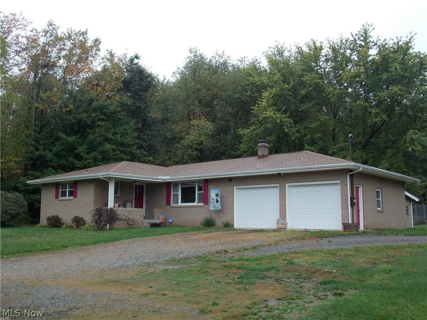 This custom built brick home sits on 1.29 acre lot. Spacious eat in kitchen w/ceramic flooring. Bedrooms, hallway and living room have beautiful oak hardwood flooring. Master bdrm w/half bath. Plenty of room in finished basement for entertaining!  Newer roof on main house in 2014 and also on detached garage. New garage doors, hot water tank and glass block windows in basement. Cement block bldg. can accommodate 4+ cars and has insulated ceiling, oil furnace and 13 ft. overhead door. Great for motor home storage or large truck! Approximate 700 sq. ft.finished in basement.