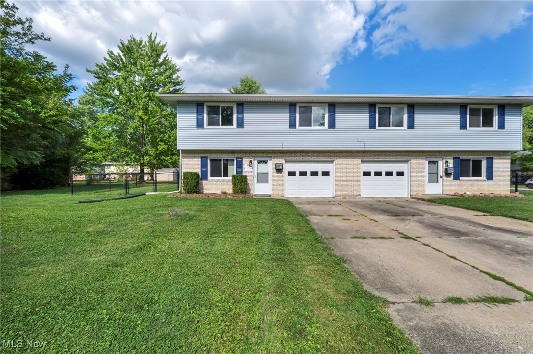 Outstanding opportunity to own a completely turnkey Colonial duplex in Stow, Ohio. Situated on a corner lot, these sparkling clean 3/1.5 and 2/1.5 side-by-side units feature attached single-car garages, freshly painted and stained 16 x 14 private decks overlooking a very large fully-fenced backyard with a fire pit and shared shed. Inside you'll appreciate low maintenance plank flooring and freshly cleaned carpets throughout. Unit 4701 features 3 bedrooms (2 upstairs, 1 down) with nicely updated kitchen, 1 full bath and one half bath, instant hot water among improvements. Unit 4697 features 2 bedrooms up and additional living space on the ground floor that could easily be converted to a 3rd bedroom; kitchen is updated with dishwasher, soft-close cabinetry and butcher-block sideboard in eat-in kitchen; newer HWT. Both units include electric range and fridge, en suite laundry rooms with washers/dryers, garage door openers. Great option for house hacking, investing, or multi-generational home; close to shopping, dining, and situated in the exceptional Stow school system.