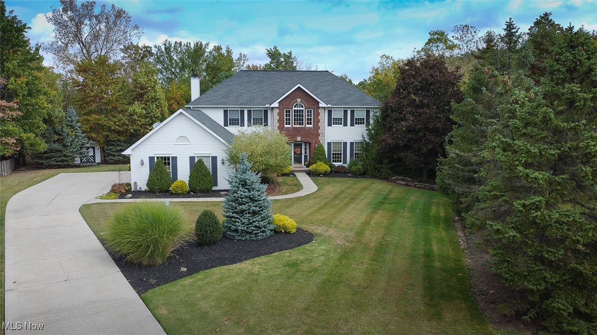 Welcome to this rare opportunity-an original-owner home where pride of ownership shines throughout. Nestled on a quiet cul-de-sac, this 4-bedroom, 3.5-bath home offers nearly 4,000 sq. ft. of beautifully finished living space on a private ½-acre wooded lot.
Step inside the 2-story foyer and you’ll immediately notice the thoughtful details: crown molding, Anderson windows, and a floor plan designed for both everyday living and entertaining. The first floor features a private office with double doors, formal living and dining rooms, and a family room with a brick gas fireplace, wet bar, and double-door access to the serene backyard. The eat-in kitchen offers Corian countertops, island, stainless appliances, pantry, and double sink. A powder room with granite vanity, laundry room (washer/dryer stay), and plenty of storage complete the main level.
Upstairs, the spacious master suite impresses with vaulted tray ceilings, dual walk-in closets, a Jacuzzi tub, updated shower, dual vanity, and linen closet. Three additional bedrooms one with double closets share the other upstairs sparkling full bath.
The walk-out basement adds even more living space with a partially finished rec room, custom storage, full bath and summer kitchen. Step outside to enjoy the professionally landscaped yard with stone walkways, paver patio, fire pit, water feature, and storage shed. A 3-car garage with attic storage ensures plenty of space for everything. Updates include newer roof, high-efficiency furnace, and central air. This is a one-of-a-kind property combining comfort, space, and an unbeatable setting—schedule your private tour today!