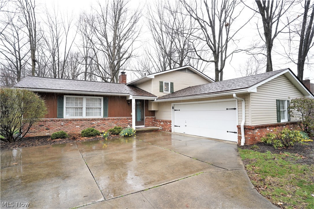 What a great 4 level split located in Heather Hills in Stow. Minutes to Route 8 offers ease in commuting either North towards Cleveland or South towards Akron/Canton. Convenient to bike/hike trail on Springdale Rd. This home has been lovingly cared for by the current owners. The living room and dining room boasts high vaulted ceilings creating an open and spacious feel. There is a 3-season sunroom located off the dining room that offers a fabulous view of the wooded/treed backyard and leads to a patio with a gas line for a grill. The kitchen, bar off family room and both bathrooms have Schrock cabinets. The lower level has a family room with a gas fireplace and an additional room with a wet bar that can serve many purposes. All wood trim throughout the home was replaced by the current owners as were the solid wood interior doors. Hardwood flooring under the carpet throughout. The central air conditioning was replaced in 2014. The furnace is approximately 10-12 years old. The hot water