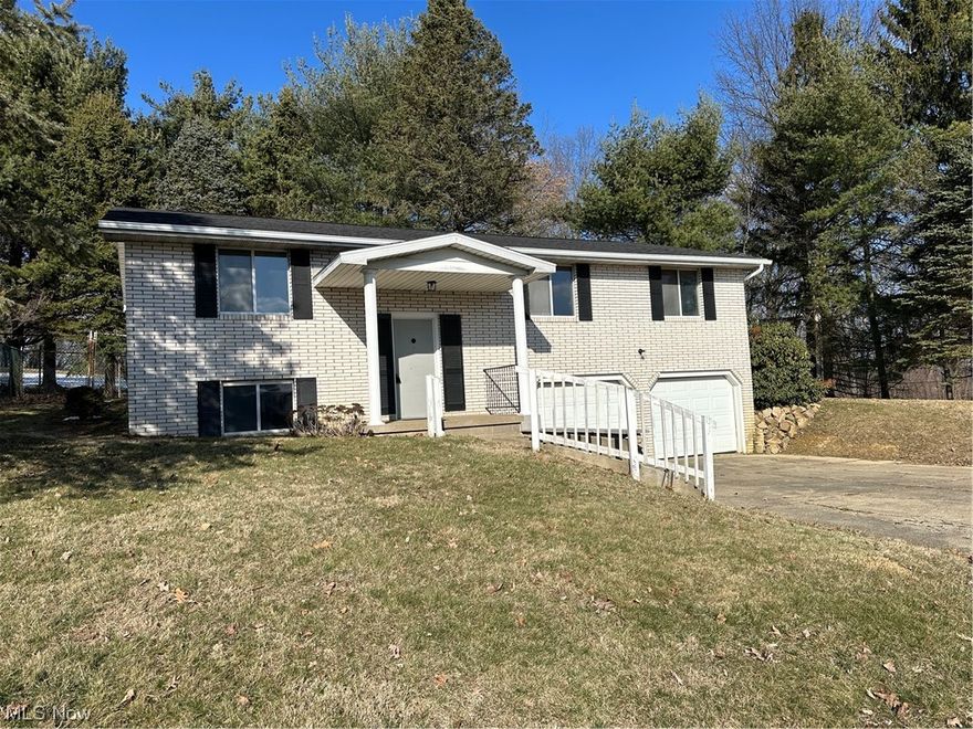 Quiet Dover location. One owner home. First floor has a spacious kitchen with breakfast bar, laminate countertops, lots of cabinets and new laminate flooring. Dining area leads out to a patio with a fenced yard. Living room and dining area are open to the kitchen. Three bedrooms and bath complete the first floor. Lower level has a laundry room with half bath. Family room has a wet bar, (hot water faucet doesn't work), with new carpeting. House has a waterproofing system from OHIO STATE WATER PROOFING, there is a $75 YRLY MAINTENACE fee for a yearly checkup. Improvements are new Roof (2020) and spouting with leaf guard (2023) ,glass block windows (2023), water softener (2023) , Water heater 2020, some new carpeting and laminate flooring, most new interior painting (2023). The rear property line is the second chain link fence, left side is to the end of sidewalk and right side is close to the stone wall. Some landscaping on the left is to be completed when weather breaks. Property is easy to show. Please visit the interior before walking outside or remove shoes when entering (New Flooring). Seller is offering a 1 year home warranty.