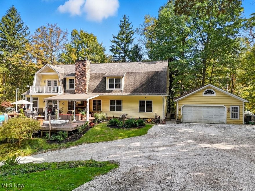 Welcome to your own private retreat. Nestled on a secluded 2.15 acre lot in the Ghent Village subdivision, this timeless colonial offers the perfect balance of classic elegance and modern luxury. Spanning over 4,000 square feet, the home features 5 spacious bedrooms and 2 full baths,1 half bath, thoughtfully designed for both everyday living and sophisticated entertaining. At the heart of the home, a chef's kitchen impresses with a massive granite island, high end finishes, and an open layout that flows seamlessly into the living and dining areas. Step outside and discover a true resort experience. The backyard is a private oasis, showcasing a custom inground pool, complete with a stylish pool house featuring its own bathroom, an outdoor kitchen for al fresco dining, and a dramatic stone fireplace that invites year round enjoyment. Surrounded by lush landscaping and absolute privacy. It's the perfect setting for unforgettable gatherings or quiet relaxation. This exceptional estate combines the charm of Cape Code Colonial architecture with resort style amenities rarely found in a private residence. A rare opportunity to own a home where every day feels like a vacation.