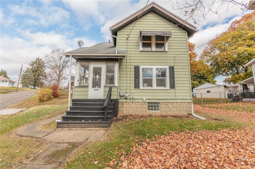 This charming, fully updated colonial-style home in Akron offers so much character. This darling home features two spacious bedrooms and two full baths. Step inside to find a bright, open floor plan featuring freshly painted walls, stylish fixtures, and beautiful flooring throughout. The living room has a large front window to allow natural light to shine in. The living room flows seamlessly into the dining room, which would allow for the perfect entertaining space. The kitchen has been fully modernized with stainless steel appliances, and white shaker cabinets. Upstairs, two generously sized bedrooms offer abundant natural light, closet space, and a tastefully renovated bathroom with contemporary finishes. The basement is partially finished with a full bathroom, perfect for an office space or entertaining room. Outside a cozy front three season room allows you to enjoy the landscaped yard through the seasons. Located in a quiet, well-established neighborhood, this home combines timeless colonial charm with all the updates you need for modern living.