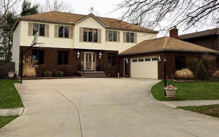 Be first or be sorry! Pride of ownership here! Immediate possession! 5 bedroom, 2 full and 2 half bath colonial on a cul-de-sac street. Updated eat in kitchen with oak cabinets, pantry, buffet, desk area and ceramic flooring. Formal dining room includes chair rail and crown molding. Large living room features crown molding. First floor home office with built in bookcases. 2 story foyer boasts ceramic flooring. Family room features full wall brick fireplace, crown molding, wet bar with wine rack and a slider leading to a deck overlooking the private yard and wooded views. First floor laundry room. Master suite has big walk in closets with custom built ins, full bath with his/her sinks, heated flooring and custom tile shower. Main bath updated with his/her sinks, granite tops and custom tile tub surround. Loads of storage throughout. Walk out basement boasts recreation room, half bath, workshop, bonus room and mechanical area with wet bar. Oversized side load 2 car garage includes hot/co