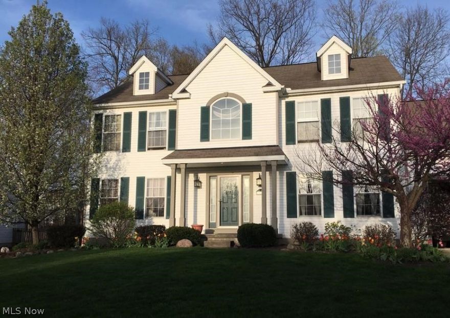 Great curb appeal and meticulously maintained, describes this 4 bedroom home located on a quiet street inside the Dover Heights Subdivision of Medina. Spacious 2 story foyer with plant ledge above, provides a welcome transition to the formal living and dining rooms. Cozy family room, complete with distinctive custom oak wood burning fireplace provides the perfect spot to relax after a long day of work. Stylish, well designed kitchen with wrap around counter top area will spoil the chef. Huge pantry area for additional storage. Formal Dining Room features tray ceiling. First floor laundry room is nicely sized, equipped with a laundry tub. Spacious, upper floor master bedroom suite features cathedral ceiling and plant ledge, with his and her closets, glamour bath with soaking tub, separate shower, spotless condition. 3 other bedrooms along with a full bath on the upper level - all nicely sized.  The huge basement could easily be finished off for additional living area. Attached 2 Car Gar