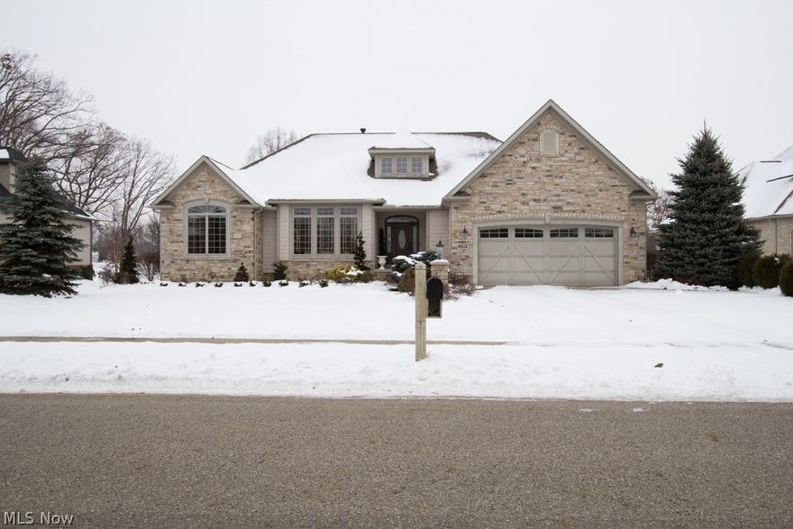 This KNL Custom built home is the dream property for any golfer.  The home features a beautiful kitchen w/custom built birch cabinets, granite counter tops & ss appliances, 3 BD, 3/1 BA and a finished walkout.  The great room has a 2 story wall of windows giving you an amazing view of the 16th hole of Mayfair Golf Course.  The finished walkout is ideal for entertaining your guests or as an in-law suite and features a spacious bedroom w/full bath and over sized family room with gas FP.  You will love to entertain your guests at the custom built bar w/beautiful granite tops and lots of cabinet space for your bar necessities.  If the 2 car garage isn't enough for your family this home is equipped with a one bay garage on the lower level to store your Gold Cart, lawn furniture and other necessities.  The rear patio is surrounded by brick wing walls with add privacy to your outdoor entertaining while enjoying a view of the Golf Course.