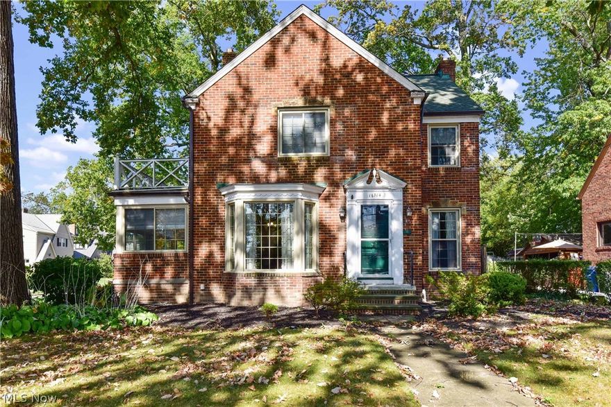 Charming brick colonial located in a quiet neighborhood in western Lakewood close to the Metro Park and a 3 minute walk to the playground. Masterful renovation (top to bottom) with thoughtful consideration to the age and character of the home.  Original red oak floors have been restored throughout and stained a rich espresso.  Solid wood paneled doors have original hardware with glass knobs.  Kitchen taken down to the studs, enlarged and outfitted with Amish built cabinetry.  The LG stainless appliances remain.  Kitchen is light and airy with a window over the sink, white subway tile back splash and granite counters.  The exposed brick adds interest and warmth.  Updated half bath on the first floor.  The owners say the light filled sun room off the dining room is one of their favorite rooms.  Heading upstairs, you will find a large master bedroom and two good size bedrooms. Loads of closets (one cedar) and a nicely renovated full bath.  The finished third floor is 400+ square feet (in