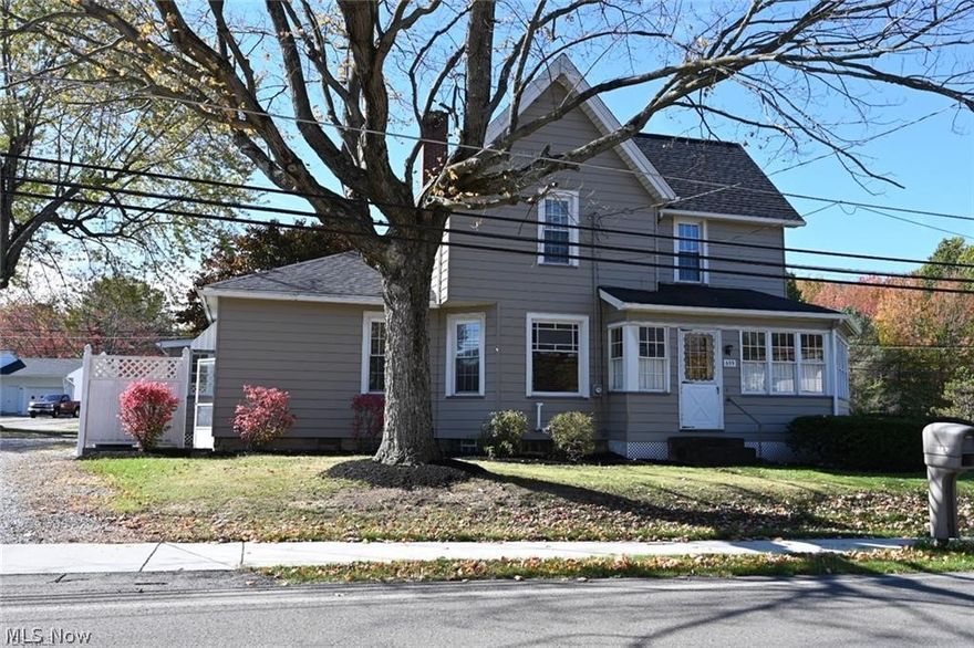 This Gorgeous Century Home is UPDATED and MOVE IN READY in the Nicest Town in America.... Columbiana. This home offers 1996 sq ft of living space and low taxes! The home also sits on a 1.06 acres landscaped city lot with beautiful establish hardwood trees. The first floor offers a mud room as you walk into the home. The equipped kitchen is very large with laminate flooring and a walk in pantry with built in cabinets. Off the kitchen is a Laundry and Half Bath. A formal Dining and Living Room with decorative fireplace are both large and welcoming. The final room on the first floor could be an office or bedroom. Check out all the beautiful woodwork as you walk up to the 2nd floor where you will find a FULL Bath with Shower/Tub and 3 Large Bedrooms. Super convenient walk up attic that could be finished or used for storage. The home updates include newer windows, roof, and freshly steam cleaned carpets. Avg Gas is $80/month. CALL TODAY for a private showing