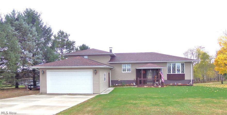 REWARD YOURSELF! Country roads take you home to this spacious and updated 3 BR, 3 bath home situated on 2.19 acres of your own sweeping grounds.  Large, comfortable LR leading to a cook-friendly kitchen and generous DR both with gleaming, rich oak flooring. 2nd kitchen and rec rm that open to the back yard perfect for entertaining. Relax after a long day and enjoy nature on the 10x20 covered deck. Fantastic bonus of a 3 car garage, 10x20 shed and much more. Homes like this don't come along often, call today