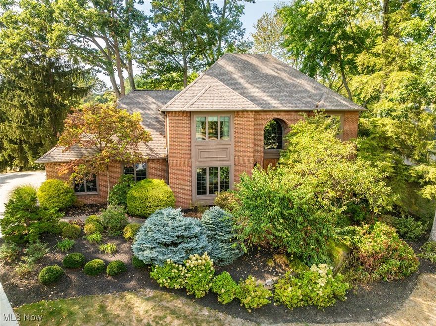 Luxury Living in the highly sought-after Glenmoor Estates, situated on the Jack Nicklaus Signature Golf Course. Tucked along the prestigious Jack Nicklaus Signature Golf Course with an enviable view of the water feature on hole #7, this exquisite brick residence offers four spacious bedrooms, 3.5 bathrooms, and a mostly finished lower level. From the entry, step into the foyer with your office/den to your left and your living room to your right. Off the living room is the dining room with easy access to the kitchen. In the Florida room, you'll find newer carpet, and French doors lead to a deck and gazebo, the perfect spot to enjoy the serene views of the fountain. The great room, enhanced by skylights, a wet bar, a gas fireplace, and views of the course, flows seamlessly into the kitchen, which features wood cabinetry, Corian countertops, a tile backsplash, a pantry, and an eat-in area. Completing the main floor are the laundry room and the 1/2 bath. Upstairs, the primary suite features dual walk-in closets and a luxurious, spa-like bathroom, complete with a soaking tub, glass-enclosed shower, dual vanities with granite countertops, and exterior access to the balcony. Three additional bedrooms and a full bath complete the upper level. The lower level is an entertainer's dream, complete with a full bar featuring granite counters and a stained-glass wine cellar. A spacious rec room with a gas fireplace, multiple bonus rooms, and an updated full bath with a sauna add to the luxurious amenities. The exterior features include a 3-car attached garage and a back deck with a gazebo overlooking the course, which provides views of the fountain. Plus, you are not too far from Belden Village and highways. Don't miss your chance to see this beautiful home; schedule your showing today!