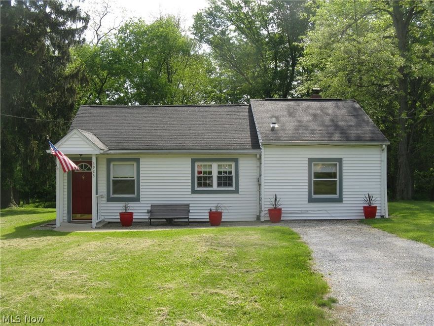 Charming ranch with yard that offers a wooded backdrop on a quiet street in Coventry school district. park at end of street for the kids.