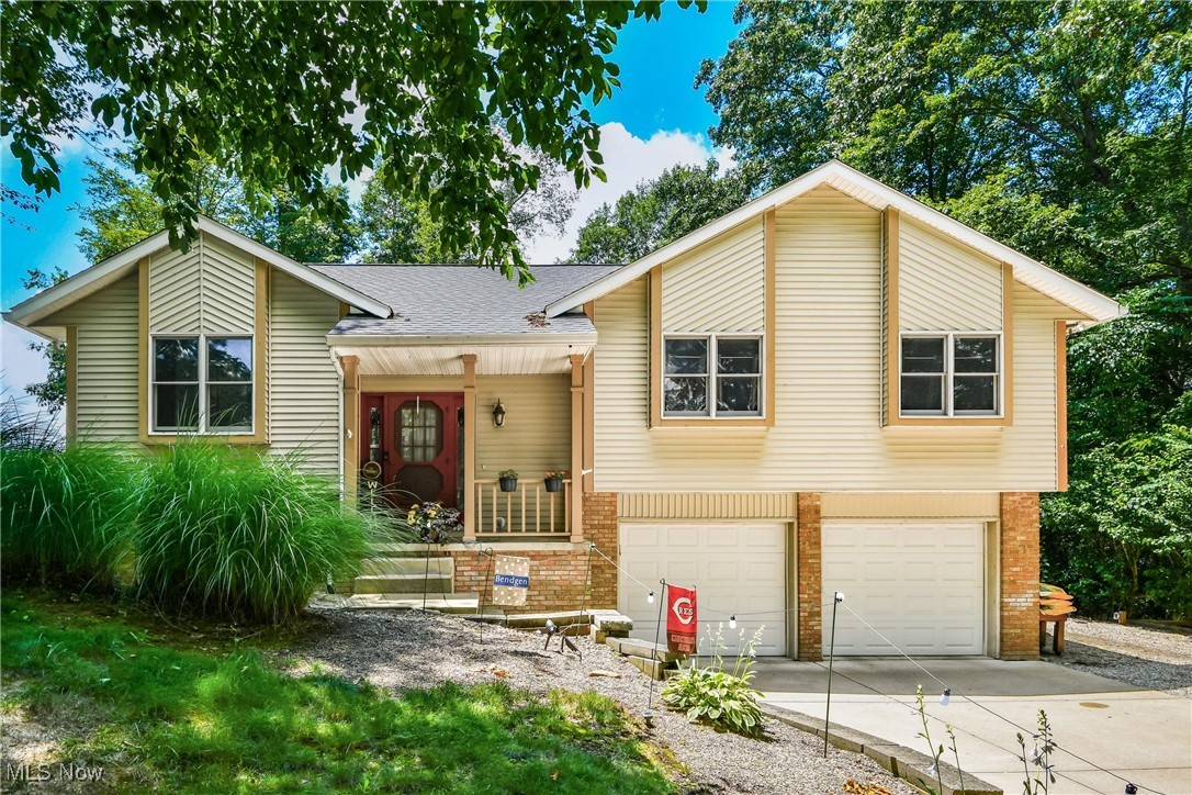 Nestled upon 1.46 wooded acres, this beautifully updated bi-level home offers a seamless blend of modern comfort and natural tranquility. The main level boasts 3 spacious bedrooms and 2 full baths, including a primary suite with its own private bath. You’ll also find a warm and welcoming living room, a cozy den, and a well-appointed eat-in kitchen featuring sleek stainless-steel appliances.
Step into the breathtaking family room—a light-filled sanctuary that invites you to relax, entertain, or simply soak in the peaceful views year-round.
Downstairs, the lower level offers a generous family room, another full bath, and a convenient laundry area—providing flexibility for every lifestyle.
Step outside to a sprawling back deck complete with a soothing hot tub, perfectly positioned to overlook your own wooded, tranquil oasis—a serene space for stargazing, savoring your morning coffee, or unwinding in complete privacy.
A 2-car attached garage adds everyday convenience, while the home's prime location ensures quick, easy access to Interstate 70.
This hidden gem is your invitation to peace, privacy, and effortless living—schedule your private tour today!