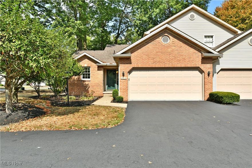 Enjoy the three floors of tastefully updated living space found within this remarkable Canfield condo! Tucked away in a private development and enjoying a park-like setting beneath the trees, this fantastic location puts you just minutes away from the hottest local eateries and shopping districts alike along with easy highway access for commuting. The brick-faced end unit welcomes you near with its two-car, attached garage and manicured cement sidewalk leading to the covered entryway. Inside, a large foyer reveals hardwood styled flooring that continues throughout the home. Closets line the near hallway, sweeping past stunning full bath and accompanying walk-in closet before finding the first-floor master bedroom. Past the foyer, the main staircase rises past a posh living room with its gas fireplace located along the far wall. Revel in the sun washed kitchen where custom cabinetry joins the elaborate kitchen. Wicker accents hang over the eat-in dining space, set before the privacy fence lined rear patio. Upstairs, the brightly lit loft joins a second half bath and an instantly engaging guest bedroom. At the basement level, provisions for a third bedroom are joined by yet another full bath, central rec space currently configured as a home gym and lower laundry services.