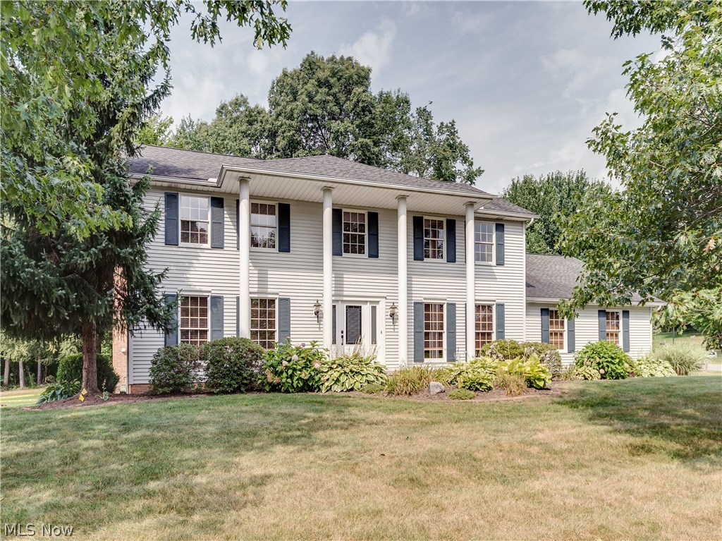 Location Location! Beautifully updated 4 bedroom/3.5 bath colonial, approx. 3168SF including finished lower level, 3 car side load garage & conveniently located in City of Green* Foyer entry with wood floor, crown & new beveled glass door & side lights* Great room with brick gas log fireplace opens to living room/den* Formal dining with crown & chair molding* Updated eat in kitchen with granite counter tops, tile back splash, new stainless refrig, dishwasher & microwave (6 mos. old) & Jenn air range, island & pantry* Dining area with slider to oversized deck* 1st floor laundry with tub* Updated half bath completes the 1st lfoor* 2nd level with spacious master bedroom w/walk in closet with built ins*. Updated master bath with his & hers vanity, granite, heated tile floor, tile shower & jetted tub, 3 additional bedrooms & guest bath* Lower level with full bath, family/media room includes projector, surround sound--speakers & equipment, built in storage bench, wet bar with refrig, wine