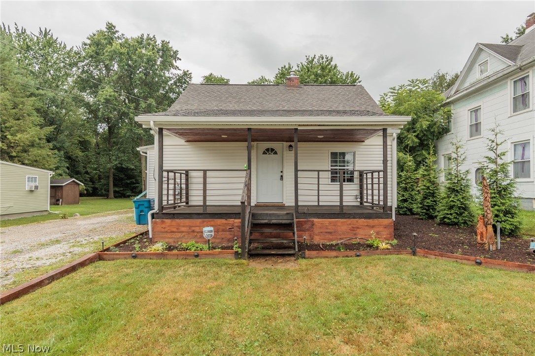 A charming Hartville bungalow with a dream back yard. This lovely home features a custom kitchen with quarter sawn white oak countertop, shaker style soft close cabinets, a whitehaus sink, and wonderful ceramic floor. The oversized bathroom with blow you away. Of then many characteristics of this home, the stairs are a live edge cherry, with a handrail made of finger joined black walnut, which is also a few of the doors. The open living room has a built in entertainment center made of ambrosia maple wrapped in tongue and groove knotty pine. There is a front porch is made of 2" eastern red cedar, as are the Pavilion and Pergola. The yard is completely fenced. A full basement, garage, and so much more.