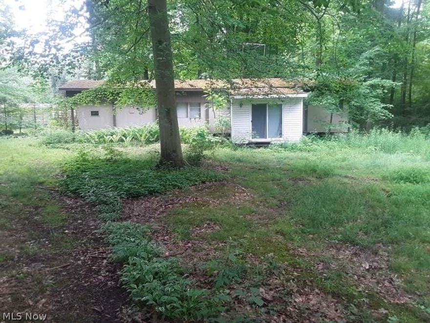 Come and enjoy this property nestled in the trees near Pymatuning Lake. Private quite lot at the end of a no outlet street.