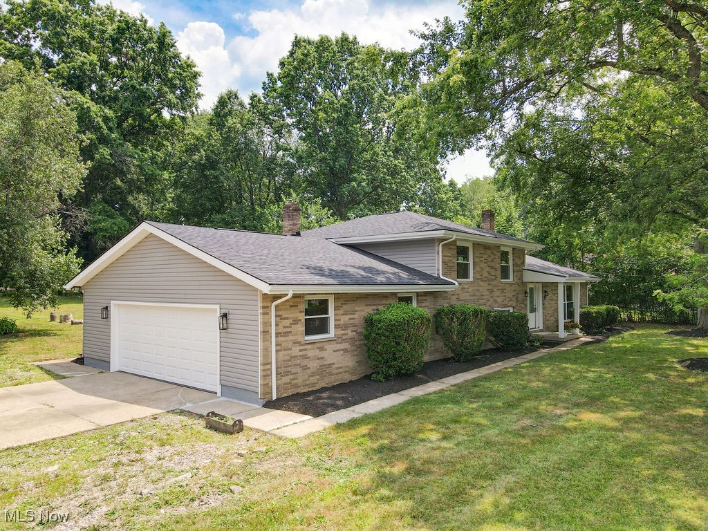 Nice 3 bed/2.5 bath brick split level on quiet park like setting. This home has been remodeled from top to bottom with new flooring, paint, open gorgeous gourmet kitchen with SS appliances, granite counters, and lots of storage and walk-in pantry. The dining area and great room on the first floor add so much appeal to this home and there is a walk out slider to the patio. The spacious bedrooms and family room with fireplace and half bath are perfect for entertaining and relaxing. The master suite is so grand with an attached en-suite with brand new walk-in shower, and oversized closet. The lower floor has a full office, half bath, living room and a huge utility room. The yard is extra large and has concrete porch with a shed. Everything is new: roof, siding, windows, doors, kitchen, vanities, garage door, hot water tank and HVAC! This home is move in ready and priced to sell.