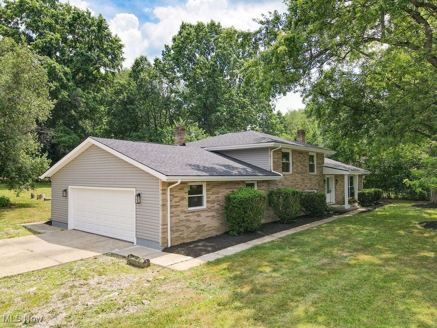 Nice 3 bed/2.5 bath brick split level on quiet park like setting.  This home has been remodeled from top to bottom with new flooring, paint, open gorgeous gourmet kitchen with SS appliances, granite counters, and lots of storage and walk-in pantry. The dining area and great room on the first floor add so much appeal to this home and there is a walk out slider to the patio. The spacious bedrooms and family room with fireplace and half bath are perfect for entertaining and relaxing. The master suite is so grand with an attached en-suite with brand new walk-in shower, and oversized closet. The lower floor has a full office, half bath, living room and a huge utility room. The yard is extra large and has concrete porch with a shed. Everything is new: roof, siding, windows, doors, kitchen, vanities, garage door, hot water tank and HVAC! This home is move in ready and priced to sell.