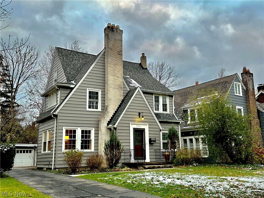 Welcome to this lovely Shaker Heights classic in a great location on a desirable tree-lined street, w/ dual system CENTRAL A/C and boiler heat. This spacious 3-story home includes almost 2,300 finished sq ft, 3rd level suite with a bedroom, and a full bathroom and a loft. Updated kitchen with stainless steel appliances, tile backsplash, and granite countertops. Large living room with a fireplace. Family room with with bay windows. Gorgeous hardwood floors throughout the first level. Full basement. Second floor bedroom off the staircase has an access to a balcony and could be used as a private office being separated from the other bedrooms. 2-car garage. RECENT UPDATES: newer roof, A/C, heating system, windows, appliances, kitchen cabinets and granite, bathrooms, light fixtures, carpeting upstairs, freshly painted walls, ceilings, and trim, refreshed landscaping and more. INCLUDED are ALL kitchen appliances, window treatments, and a 1-year home warranty. Located just steps from a Blue/G