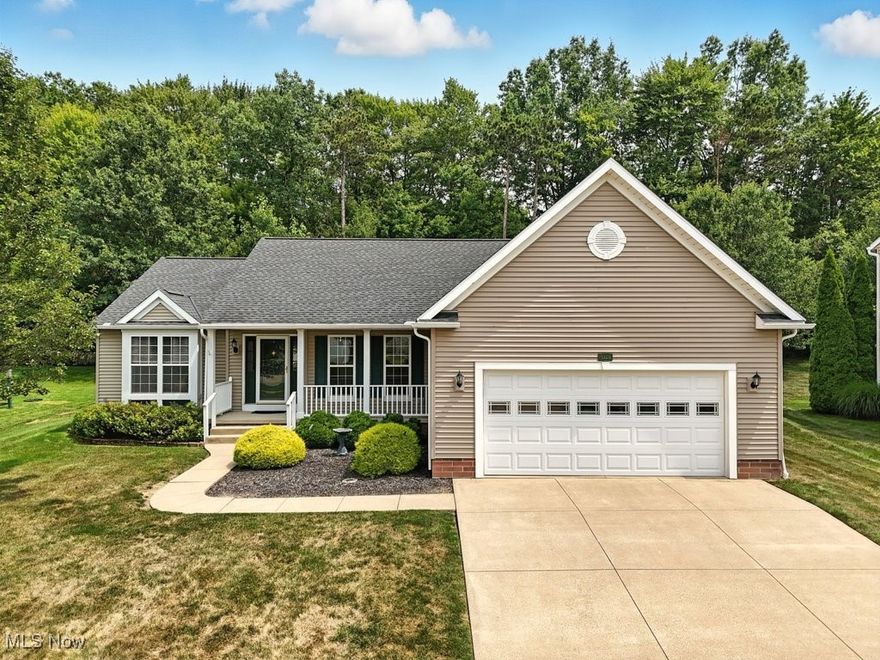 Welcome to this beautifully maintained 3-bedroom, 2-bath ranch home offering comfort, space, and a smart layout ideal for modern living. The heart of the home is the open-concept main living area. The dining room boasts a tray ceiling and elegant crown molding, while the inviting living room features vaulted ceilings, crown molding, and a cozy gas fireplace with remote — perfect for gatherings and quiet evenings alike. The eat-in kitchen offers abundant cabinetry and countertop space, making it ideal for meal prep and entertaining. The spacious and private owner’s suite is a true retreat, featuring vaulted ceilings, a walk-in closet, and a large en-suite bath with a garden tub and separate shower. On the opposite side of the home, you’ll find two additional bedrooms and a full bath, providing privacy and flexibility for guests, family, or a home office. The oversized two-car attached garage offers convenient direct access to both the main floor laundry/mudroom and the full basement. Step outside to a private backyard with a generous deck—ideal for relaxing or hosting outdoor get-togethers. Notable updates include a new roof and gutters (2017) and updated laminate flooring throughout the main level. A one-year Home Warranty is being offered for the Buyer's peace of mind! Conveniently located near I-76, Kent State University, and NEOMED—this home checks all the boxes for comfort, location, and value!