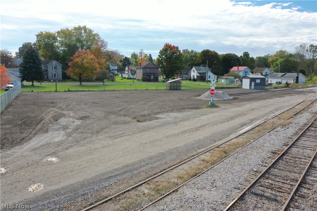 Here's a unique opportunity to buy a fully operational rail-spur in Orrville, OH. 283 ft of rail has been rehabbed and inspected back to the main-line of Wheeling & Lake Erie Railway. 90'-100' of usable unloading space. For centerbeam cars, there is ample space to access and unload from both sides of the car. There's a large parking area finished with asphalt grindings and a fence on the boundaries. Additionallly, on the 0.69 acre property is a 12' x 20' shed insulated with spray foam and would be ideal to park your forklift in. Ramps and platforms to unload box cars are on the property and would be included with the sale. Fully operational and turn-key opportunity to ship by rail with room on the property to add an additional length to the rail if needed.