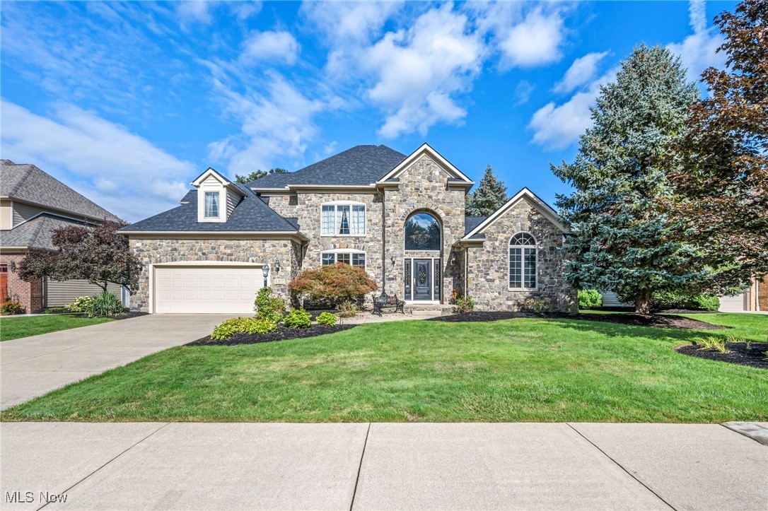 Elegant and versatile, this custom home sits proudly on the 11th fairway of the prestigious Red Tail Golf Club, offering over 5,481 sq.ft of refined living space designed for multi-generational lifestyles. A brand-new complete tear-off roof w/ premium Owens Corning shingles was installed in August 2025 & comes w/ a transferable warranty, providing peace of mind for years to come. Inside, the main level boasts a luxurious owner’s suite w/ spa-inspired bath, dual walk-in closets, & a beautiful bay window overlooking the greens. The chef’s kitchen features a large island, built-ins, & an eat-in dining area w/ sweeping golf course views that open to a wrap-around deck. A dramatic 2 story great room w/ walls of windows, formal dining room, family room w/ fireplace, & private office complete this level. Gorgeous Marble floors Imported from Mexico, are found throughout the hallways, guest bath, laundry room & kitchen dining areas. Upstairs, you’ll find 3 spacious bedrooms including a Jack & Jill suite & a private en-suite, perfect for family or guests. The finished lower level is over 2,100 finished sq.ft and offers a fully self-contained living space ideal for in-laws or extended family. This retreat includes a 2nd master suite w/ walk-in closet & egress window, a full kitchen and bar, custom full bath, laundry room, additional living and dining areas, two multipurpose rooms, & abundant storage. Designed w/ elegance and flexibility in mind, the home also features an oversized 2.5+ car garage w/ dedicated golf cart bay & a full security system. Red Tail residents enjoy access to championship golf, pool, tennis & pickleball courts, clubhouse dining, & a state-of-the-art fitness center, a required social membership. Just minutes to Crocker Park, Avon Commons, major highways, & only 20 minutes to downtown Cleveland or Hopkins International Airport, this exceptional home combines luxury, function, & location in one of Northeast Ohio’s most sought-after golf course communities.