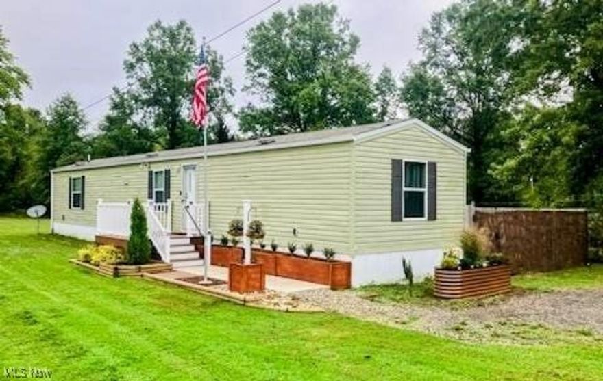 Cozy country ranch located on a private lot not in a park. Lot rent is $300/mo. Great rural location. Well and septic for this 3 bedroom, 2 bath one story living. Attractively decorated. Private fenced side patio. Storage shed. Convenient location near food & shopping. Rare mobile find to live in the country!