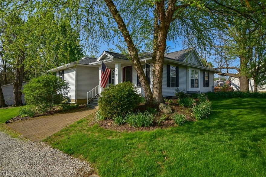 Adorable 2 bedroom, 2 and a half bath Ranch tucked away on almost 2 acres on the old Wiles Tree Farm. This home has been remodeled on the main floor, with a first floor laundry added. Kitchen opens to the great room, with all hardwood flooring and a woodburning fireplace. The kitchen features corian coutertops, stainless appliances including a Wolf cooktop all stay including washer and dryer. There is an extra washer downstairs that stays along with another refrigerator, stove and dishwasher. Roof 2020, Furnace, A/C 2011, H2O tank 2021.  Beautiful wooden deck that wraps around the back of the home overlooking the private wooded lot. Call today for showing