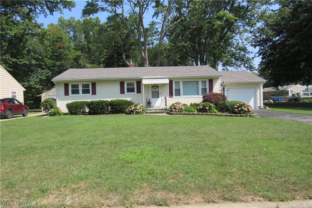 Welcome to one floor living in this 3 bedroom 1 bath ranch. Offering a warm inviting vibe, hardwood floors hide beneath the carpet per the sellers, maintainable living space and flexibility to make your dream kitchen/dining room come to life. Basement has a transferable waterproof warranty and dedicated space to create additional living space. Beautiful hydrangea bushes out front and a chain link fenced area in the backyard for your convenience accessed from the enclosed porch or back gate.