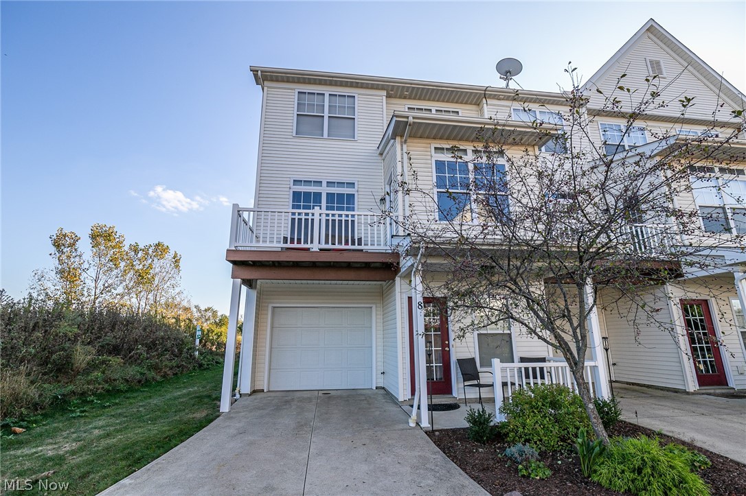 Welcome Home to 1210 E Chapman Lane Unit #8. This move-in ready, premium end unit townhouse is located in the heart of Medina, situated on a tranquil street in the desirable association of Chapman Grove, with convenient access to Route 3, Route 42, and I-71, making for a shortened commute to downtown & surrounding communities, or numerous pathways to Historic Medina Square & all the shopping, restaurants, and entertainment this location within the city has to offer. This modern 2 bed, 2.5 bath is sure to impress at over 1,400 finished sq. ft , complete with present-day color scheme (2017), vinyl plank flooring in the 1st floor foyer (2019), contemporary window treatments (2013), private paved driveway/parking, covered front porch/entryway, oversized 2-car attached tandem garage w/mechanical closet, and 12 x 7 2nd floor sundeck. The main level offers a half bath, laundry closet w/washer & dryer, sun/book nook, & open-concept great room/eat-in kitchen with luxurious laminate flooring