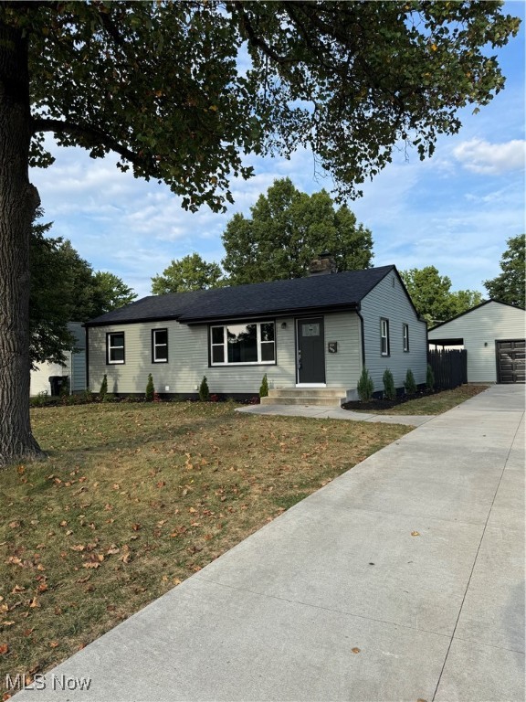 This impeccable 3 Bedroom Ranch has been a complete remodel. New landscape design, a full fenced in back yard. Recently finished and up to date with all new siding, windows, roof, concrete driveway, sidewalks front and back, the porches (front and back)also. New exterior doors in Black to match all of the trim on the siding. The flooring of the interior is LVT throughout with all new trim and casing around doors and windows.. The front door opens to the spacious Living Room all new light fixtures throughout. Amazing Eat In Kitchen has all new, to the ceiling cabinets with trim and of course certainly soft close drawers and cabinets. The subway tile back splash has been done all along the kitchen area that has granite counters. Farm sink and new Faucet. All new stainless Steel Appliances. Stove, Refrigerator, micro wave and dish washer. This home has no lack of windows and lighting. The new first floor bathroom is perfect with tub/shower available. The full bath in the lower level has a walk in shower. Glass Block Windows plenty of room. The Bedrooms are perfect size if you need to make one an office or use all three as bedrooms. The back yard is an oasis with a few trees for shade and a covered porch extends the whole length of the garage and another uncovered patio is off of the back porch. Nice sized garage with opener. The lower level has glass block windows, new furnace and A/C, new hot water tank and plenty of room. Laundry Room hookups for gas and or electric clothes dryer.