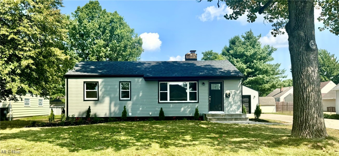 This impeccable 3 Bedroom Ranch has been a omplete remodel. New landscape design, a full fenced in back yard. Recently finished and up to date with all new siding, windows, roof, concrete driveway, sidewalks front and back, the porches (front and back)also. New exterior doors in Black to match all of the trim on the siding. The flooring of the interior is LVT throughout with all new trim and casing around doors and windows.. The front door opens to the spacious Living Room all new light fixtures throughout. Amazing Eat In Kitchen has all new, to the ceiling cabinets with trim and of course certainly soft close drawers and cabinets. The subway tile back splash has been done all along the kitchen area that has granite counters. Farm sink and new Faucet. All new stainless Steel Appliances. Stove, Refrigerator, micro wave and dish washer. This home has no lack of windows and lighting. The new first floor bathroom is perfect with tub/shower available. The full bath in the lower level has a walk in shower. Glass Block Windows plenty of room. The Bedrooms are perfect size if you need to make one an office or use all three as bedrooms. The back yard is an oasis with a few trees for shade and a covered porch extends the whole length of the garage and another uncovered patio is off of the back porch. Nice sized garage with opener. The lower level has glass block windows, new furnace and A/C, new hot water tank and plenty of room. Laundry Room hookups for gas and or electric clothes dryer.