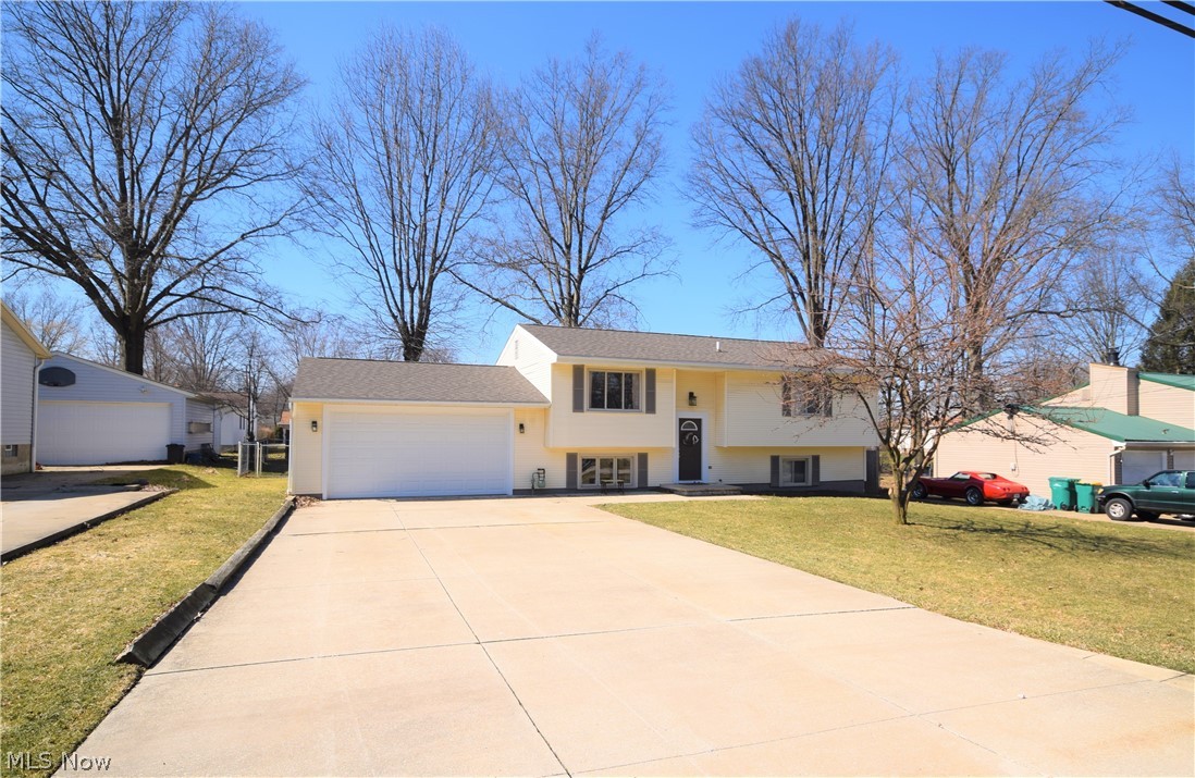 Welcome to 4178 Vira Road in Stow! You'll fall in love with this gorgeous 4 bedroom, 2 bathroom home that has endless renovations throughout. Step into the eat-in kitchen and you'll immediately be drawn to the premium kitchen flooring, stainless steel appliances, and beautiful counter tops & cabinets. You'll be pleased with how much counter and cabinet space the kitchen has to offer -- plus it has a breakfast bar! The sliding glass doors off the kitchen lead to a wooden deck overlooking the fully fenced-in backyard. The living room has a large window overlooking the front yard that allows so much bright, natural light into the home. All four bedrooms are nicely sized. Both bathrooms have newer tile flooring with gorgeous vanities and updated lighting fixtures. The fully finished basement offers a bonus living room, finished utility room, and access to the garage and triple-wide driveway. This home has a new AC unit (2018) and new roof (2017). This home has neutral decor throughout and