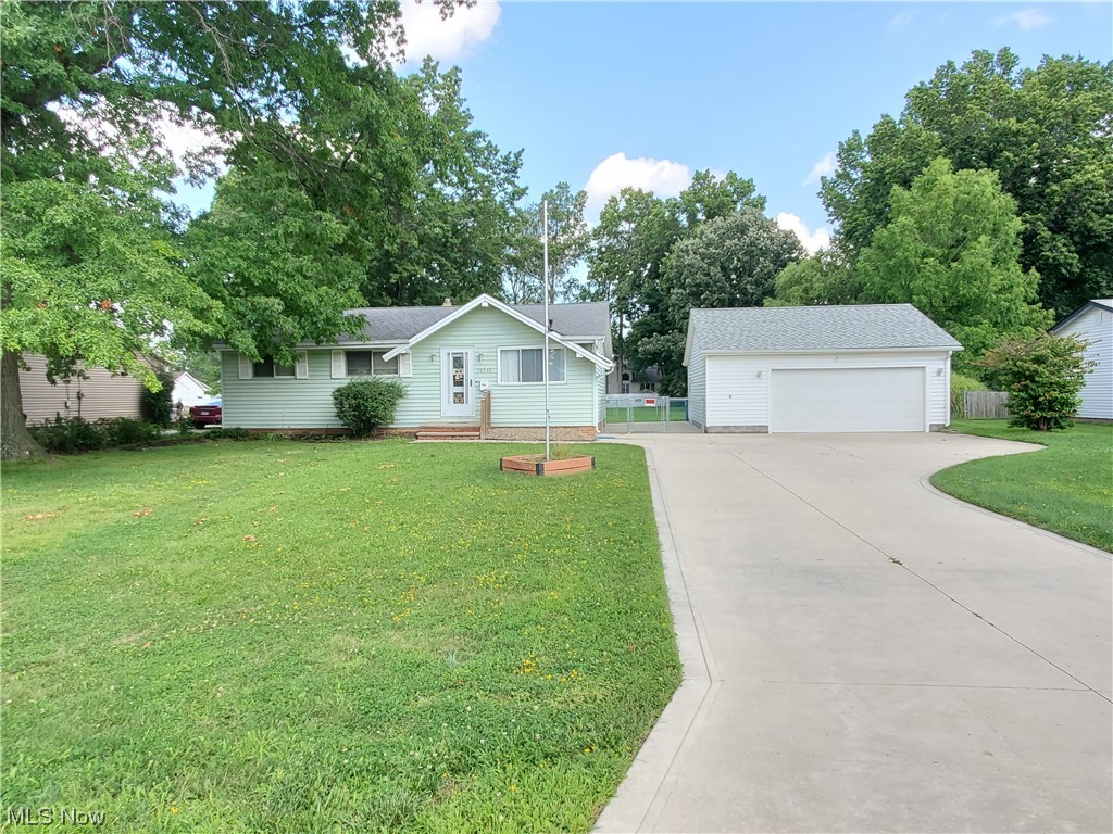 Amazing opportunity to own this one owner, three bedroom ranch in Willoughby. Large eat in kitchen with newer laminate flooring. Possible hardwood flooring thru out. This home boasts a nearly half acre park like yard with chain link fence, new 2.5 car extra large detached garage, new wide concrete drive and sidewalk. Newer mechanics; Furnace 2022, Electric upgrade to 200 amp with a whole house surge protector, Hot water tank 2018. Ohio State Waterproofing. POS has been scheduled.