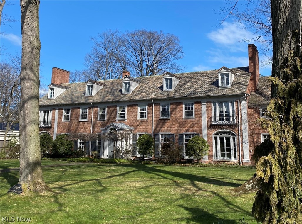 Sold before Processing. .... Distinguished Classic Brick Georgian located on tree lined boulevard in Historic district of Cleveland Heights w/stunning architectural details, arches, dental moldings & decorative plaster. The foyer opens in the back w/ French doors to a lovely gazebo. The expansive light filled living rm features an oversized fireplace, entertainment center, 3 sets of French doors & leads to large patio. The paneled family rm w/natural woodwork, 3 sets of shelves & fireplace overlooks the rear yard. The elegant formal dining rm w/ exquisite crystal chandelier & French doors w/access to the large updated kitchen w/ stainless appliances, custom Shaker style cabinets, some w/glass doors, gorgeous granite counters & backsplash, wet bar, roomy sitting room w/ wall of windows & laundry area. The master bedrm suite has a fireplace, French doors opening to Juliette balcony, 2 walk-in closets, dressing rm & updated bath w/ granite shower. There are 4 additional bedrms on 2nd. Th