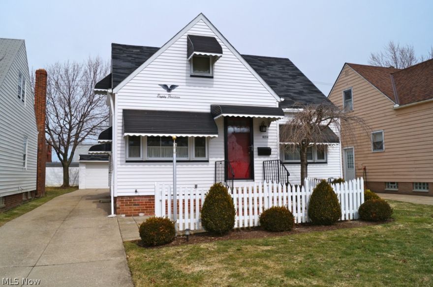 Beautifully maintained cape cod with 4 bedrooms, 2 baths, finished lower level and 2-car garage. Home is in excellent, move-in ready condition, tons of curb appeal complete with white picket fence. Original hardwoods in great condition, underneath first floor carpeting. Second level also features hardwood flooring, two bedrooms, loft hallway and huge walk-in closet. Glass block in the lower level as well as a large finished rec room, separate bonus space for an office or playroom, shower, toilet, workshop and laundry room. Brand new main electric panel, furnace and A/C 2005, vinyl replacement windows throughout and newer front door. All appliances stay, including 2nd stove. Centrally located in Parma Circle, close to highways and the up and coming Parma Shoppes.