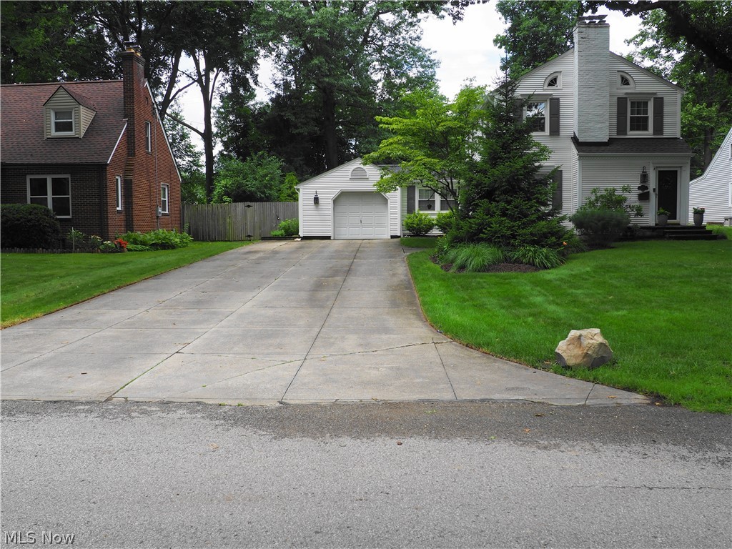 Lot: 75 X 154 Beautifully maintained 3 bderoom 1 1/2 bath colonial on a large fenced lot that boasts of a fantastic custom 26 X 24 patio great for entertaining or just relaxing. The kitchen is updated with granite counters, a pantry and appliances. The formal dining room has French doors leading to a first floor family room with crown molding and a trayed ceiling plus the half bath. The roomy living room has a gas fireplace. An attached garage into a breezeway that's ready for that morning cup of coffee. There's a basement recreation room that has a pool table that will stay if the buyer wants plus a wood burning fireplace. The basement has been waterproofed and has a transferable warranty. Roof and gutters were done in 2020. A home warranty is also included.