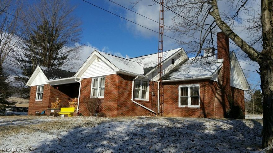 Within 2 miles of Caldwell you'll find this cozy brick home. Close to Caldwell on a State Route this brick 1.5 story 4 bedroom 2 bath home is currently rented for $2500 a month.  A detached garage with an apartment attached is also included.   If you are looking for an investment property with incredible potential return; or simply looking for your next home, this is it.