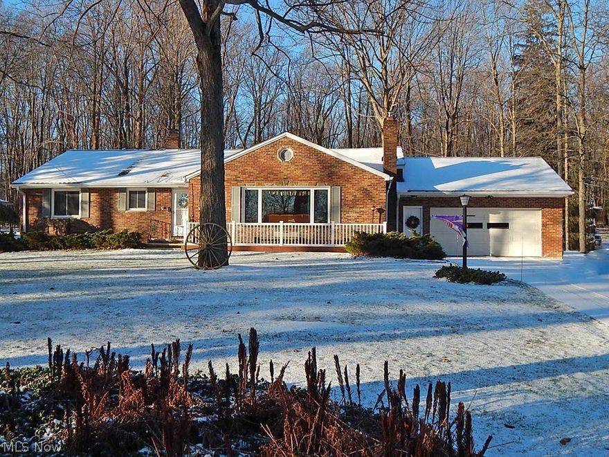 Stunning 3 bedroom solid brick ranch situated on 1.3 park-like acres!  This sensational home offers many updates and amenities throughout including 3 large bedrooms with extra closet space, large half bath (2010), oak bay window in eat in kitchen (2011), complete waterproofing (2006) w/ transferable warranty, radiant garage gas heater (2014), all plumbing fixtures (2015), roof (2010), backup power supply system (2006), and front porch (2012), just to mention a few. There are also gorgeous hardwood floors underneath the carpeting. The spacious living room offers a fabulous wood burning fireplace with custom-built mantle and ceramic hearth. The kitchen features white Decora' cabinets with many options and Corian counter tops with newer appliances.  Also Includes a formal dining room, updated main bath with double sinks and separate shower stall, The lower level features a finished recreation room, with a built-in bar & cabinets, custom fireplace insert, abundance of storage, large worksh