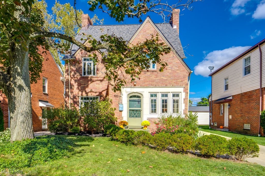 Fall in love with this beautifully maintained University Heights Colonial full of character! The charming brick exterior and lush landscaping offer great curb appeal. Inside, gleaming hardwood floors flow through the inviting living room with a cozy fireplace and a bright sunroom filled with natural light. The elegant dining room with built-in lead glass china cabinet opens to a tastefully updated eat-in kitchen featuring preserved handmade solid wood cabinetry, quartz backsplash, and newer windows. A French vintage marble light fixture adds a perfect touch over the breakfast nook. A screened-in porch and a convenient half bath complete the main level. Upstairs, the spacious primary suite includes a sitting area, generous closet space, and ample storage. Two additional bedrooms share a full bath, one with access to a charming balcony overlooking the backyard. The third floor offers a versatile vaulted room ideal for an office, playroom, or potential fourth bedroom.Outside, enjoy the beautifully landscaped yard with a patio and detached 2-car garage. Recent updates include a new roof (2024), 50-gallon water heater (2023), Bosch dishwasher (2023), new exterior paint (2023), partial driveway replacement (2022), and newer windows. Prime location! Walking distance to a park, Beachwood Place, Legacy Village, dining, and more. This vintage-style home blends timeless charm with modern convenience!
