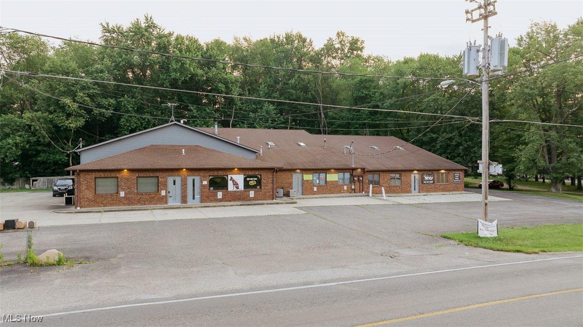 Commercial Income Producing Property, Brick & Block Construction With 5 Rental Units, 3 Phase Electric, Offices, Shop Area, Storefronts. Suffield Twp., Portage Co., Good Road Exposure.
Live Onsite with Online Bidding Available. ABSOLUTE AUCTION, all sells to the highest bidder on location. ONLINE BIDDING BEGINS MONDAY, AUGUST 4, 2025, at 12:00 PM, and AUCTION LIVE ON-SITE BIDDING WILL BEGIN WEDNESDAY, AUGUST 6, 2025, at 12:30 PM. Quality building with rental income. Built in 1989 & 1992. 8,800+ sq. ft. Commercial building, 4 units currently rented at $4,250 a month plus gas and electric. The fifth unit is owner-occupied. Five front offices/storefronts all with restrooms plus (4) shop areas with 10’ X 12’ overhead doors, all with water, heat, and restrooms but one unit. Blacktop parking. Private septic and well. (2) 200-amp. services plus 3-phase electric. New shingles approx. 5 years ago. Good building with loads of potential. .8-acre lot. Building open sale day starting at 10:30 AM.